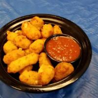 Garlic Cheese Curds · Lighted hand battered and filled with white cheddar cheese and fresh garlic and parsley.. Se...