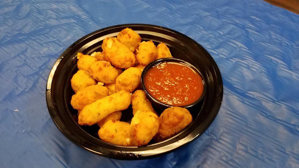Garlic Cheese Curds · Lighted hand battered and filled with white cheddar cheese and fresh garlic and parsley.. Served with a side of Marinara