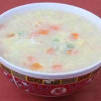Egg Flower Soup · Freshly chopped green onion, peas, carrots and egg in a tasty broth.