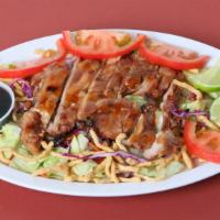 Chinese Chicken Salad · Grilled chicken meat over fresh greens topped with chinese croutons with your choice of eith...