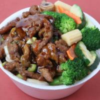 Teriyaki Beef Bowl · Beef stir-fried with white onions garnished with broccoli, carrots, baby corn, zucchini and ...