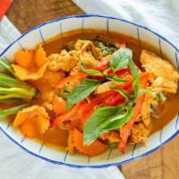 Panang Curry (Peanut Curry) · Ground peanuts, carrots, green beans, bell pepper, and basil in coconut panang sauce.