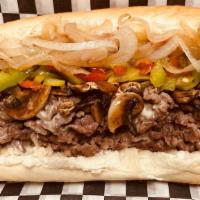 The Traditionally Philly  · Ribeye, choice of  cheese, sweet peppers, mushrooms and grilled onion.