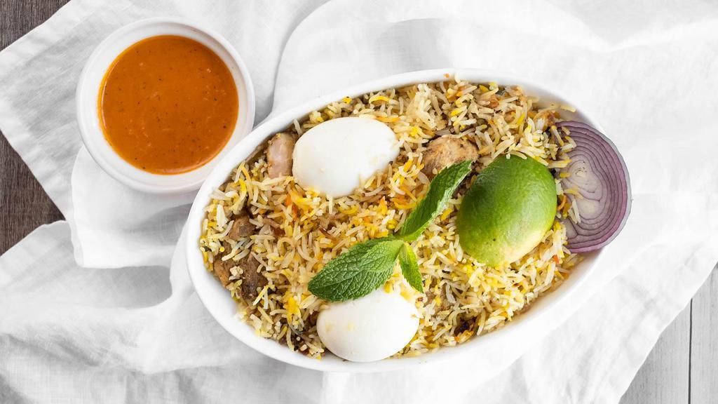 Chicken Biryani · Basmati rice cooked with chicken chunks, nuts and spices.