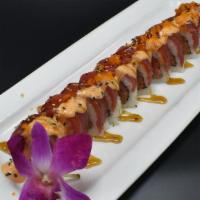 Climax Roll · In: spicy tuna, cucumber.
Out: tuna, masago, green onion, house sauce.