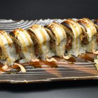 Marsmellow Roll · In: Spicy Tuna,Shrimp Tempura,Avocado.
With Cream Cheese on top and Baked. Top with Unagi Sa...