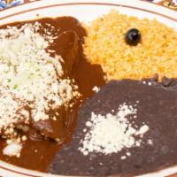 Enchiladas De Mole · Gluten free. Three corn tortillas filled with chicken breast or cheese, topped with our spec...