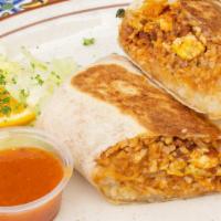 Burrito · Your choice of chicken, beef or carnitas, with rice and pinto beans, all wrapped in a flour ...