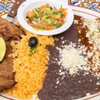 Carne A La Tampiquena · Beef steak served with one mole enchilada, guacamole, rice, black beans and two homemade cor...