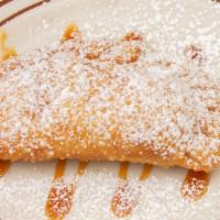 Empanada · Turnover filled with guava and cream cheese.