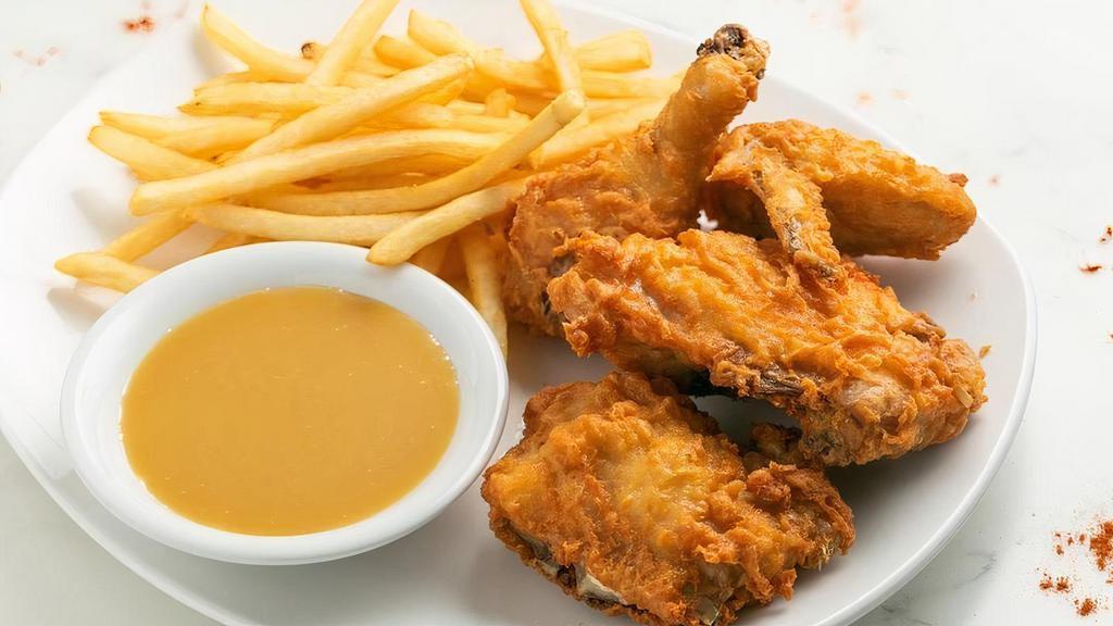 Fried Chicken · Crispy fried chicken served with seasoned fries & honey-dijon sauce.