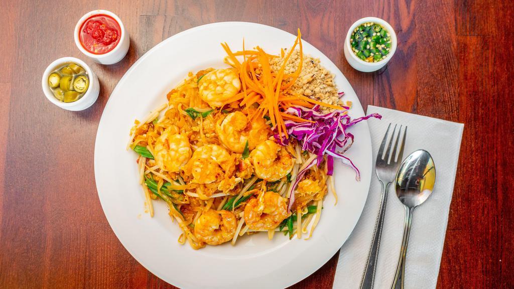 Pad Thai · Vegetarian. Thin rice noodles tossed with egg, scallions, bean sprouts in a Thai tamarind pad Thai sauce and topped with crushed peanuts.