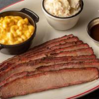 Texas Style Beef Brisket · Certified Angus Beef brisket slow-smoked and hand carved to order. Served with our savory we...