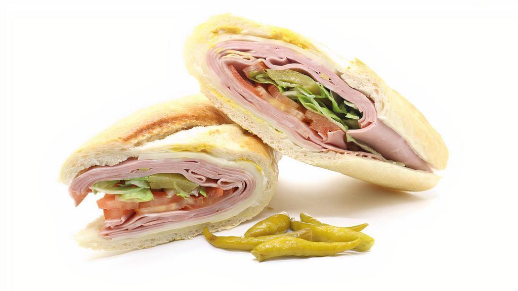 Garlic Mortadella Sandwich · Made on a 10-inch French baguette with garlic mortadella, provolone cheese, mayonnaise, lettuce, tomatoes, pickles and mustard.