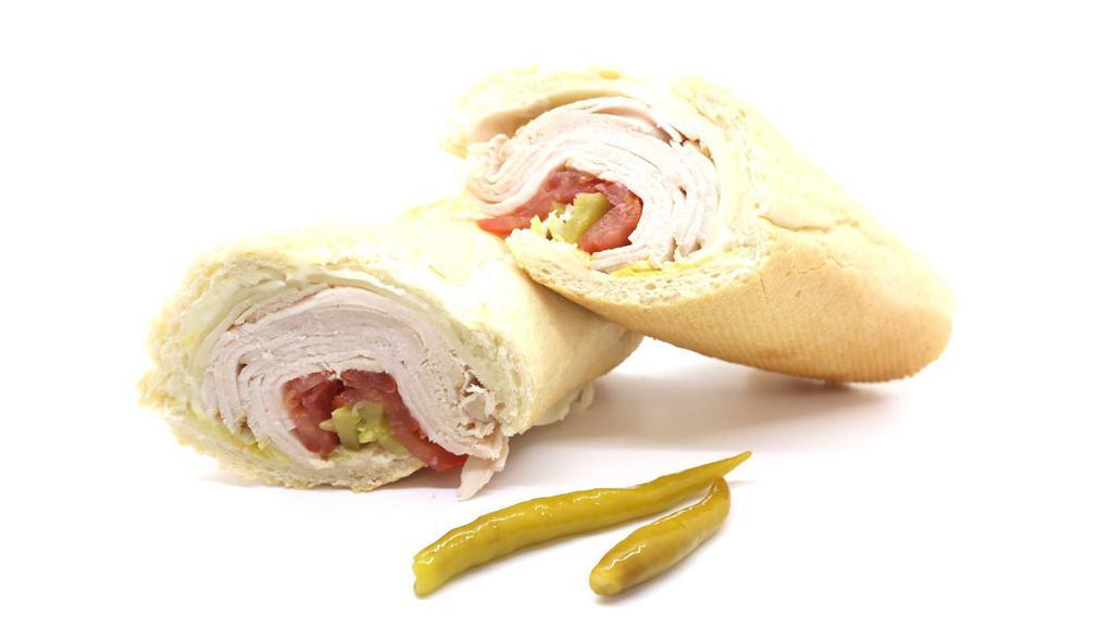 Turkey Sandwich · Made on a 10-inch French baguette with turkey, provolone cheese, mayonnaise, lettuce, tomatoes, pickles and mustard.