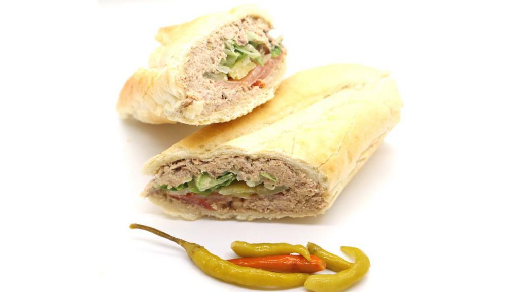 Tuna Sandwich · Made on a 10-inch French baguette with tuna, provolone cheese, mayonnaise, lettuce, tomatoes, pickles and mustard.