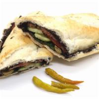 Olive Tapenade Sandwich · Made on a 10-inch French baguette with olive paste, tomatoes and cucumbers.