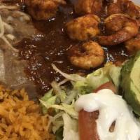 Plato De Camarones · Comes with a side of beans, rice, and small salad.
