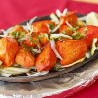 Chicken Tikka · Boneless white meat chicken pieces marinated in herbs and spices. Roasted tandoori style wit...