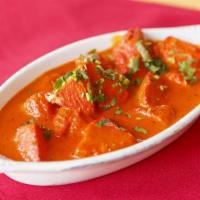 Chicken Tikka Masala · Boneless tandoori chicken tikka cooked in the clay oven in special curry and yogurt sauce.