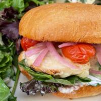 Grilled Chicken Sandwich · Chicken breast, buttermilk ranch, mix greens, tomato confit, pickled red onions, Swiss chees...