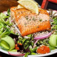 Grilled Salmon Salad · Wild caught salmon, tomato confit, quinoa, cucumber, radish, crispy onion, on mixed green, l...