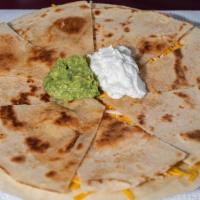 Quesadillas · Two flour tortillas stuffed with melted cheese. Your choice of meat, olives,, tomatoes, jala...