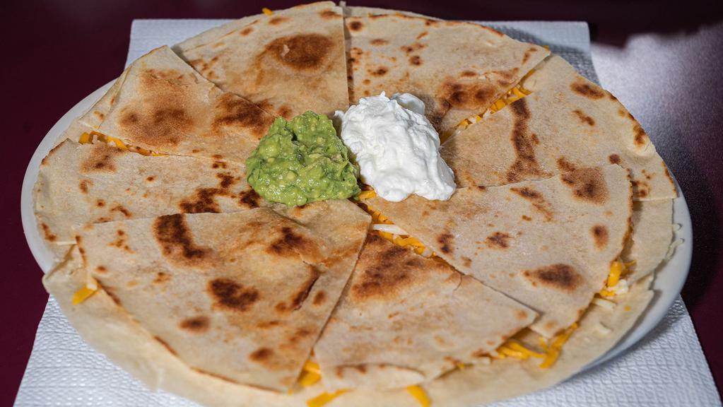 Quesadillas · Two flour tortillas stuffed with melted cheese. Your choice of meat, olives,, tomatoes, jalapeno, guacamole, and sour cream on the side.