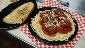 Spaghetti With Meatballs · Spaghetti with meatballs and grated mozzarella. Served with garlic bread.