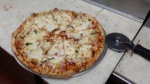 Spicy Bbq Chicken Pizza · Spicy. Topped with BBQ sauce, mozzarella cheese, marinated BBQ chicken, red onions, and cila...