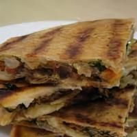 Arrays · Crispy grilled pita bread sandwiches that are stuffed with seasoned ground beef. Comes with ...