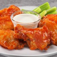 Traditional Chicken Wings · A classic combination of finger-licking flats and drumettes, fried and coated in your choice...