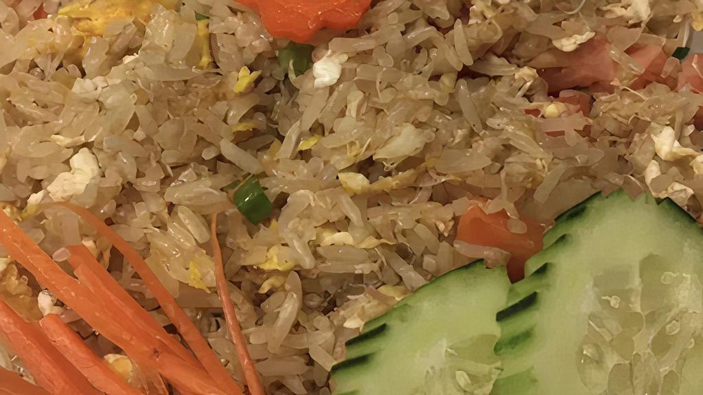 Crab Fried Rice (Kao Pad Poo) · Fried rice with crab meat, eggs, onions, tomatoes, carrots, and green onions.