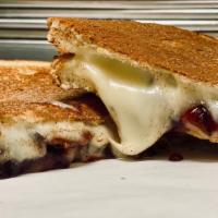 Sweet Baby Cheesus · Havarti, fontina, triple-berry jam, on sliced french dusted with cinnamon & sugar