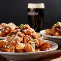 Loaded Tots · Beer cheese sauce, bacon green onions, sour cream.