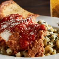 Chicken Parmesan · Cavatappi pasta tossed in our creamy spinach artichoke dip. Served with hand-breaded fried c...
