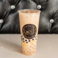King Kong · Signature Black Milk Tea (non-dairy drink) Topped with Honey Boba, Coconut Jelly & Egg Puddi...