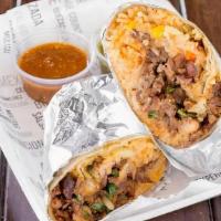 Carnitas Burrito · Roast pork. Served with refried beans, rice, onions, cilantro on a large flour tortilla.