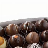 12 Piece Chocolate Truffle Box · Our signature product, the chocolate truffle, wraps creamy French-inspired ganache with dark...