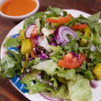 Garden Salad · Romaine and green leaf lettuce, olives, tomatoes, red onions and pepperoncinis.