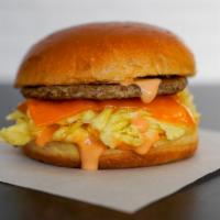 Impossible Sausage,  Egg, & Cheddar Breakfast Sandwich · 2 scrambled eggs, melted Cheddar cheese, impossible breakfast sausage, and Sriracha aioli on...