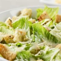 Classic Caesar Salad · Crisp chopped romaine leaves, garlic croutons, shaved parmesan.