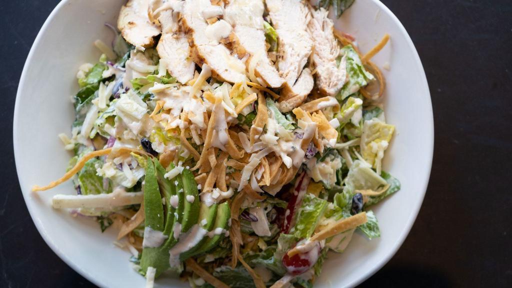 Southwestern Chicken Salad · Romaine lettuce, black beans pepper jack cheese, jicama, onions, cherry tomatoes, avocado, red cabbage, grilled ancho chicken, ranch dressing.