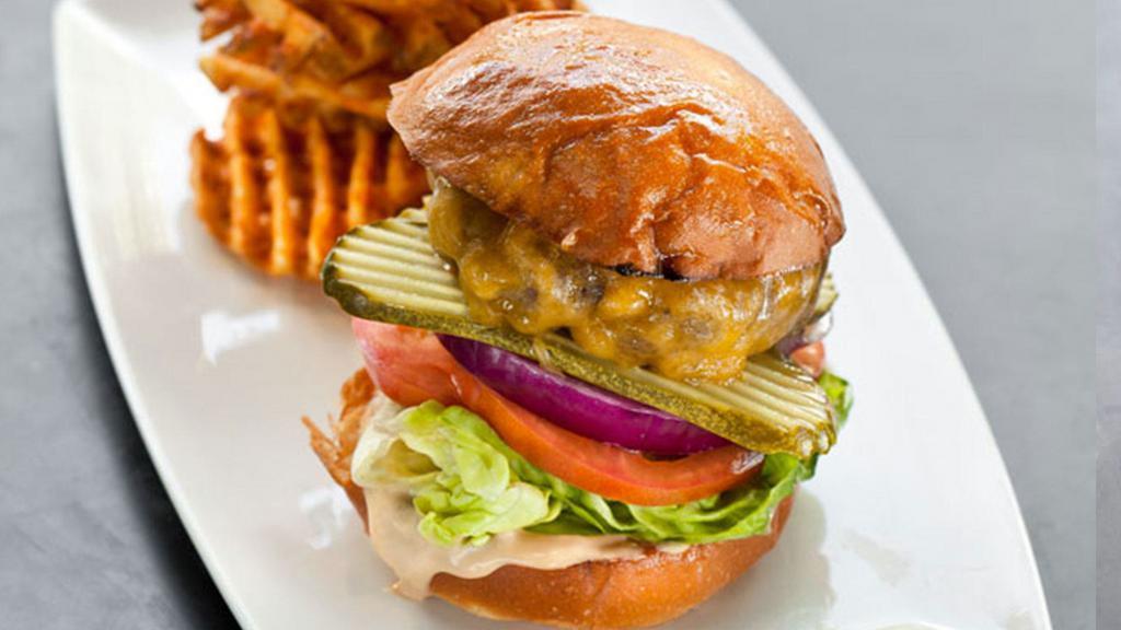 Public House Burger · Half pound burger, pickles, onions, tomatoes, lettuce, thousand island dressing.