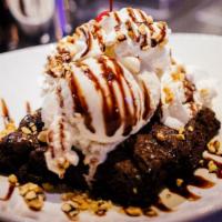 Brownie Sundae · Hot fudge, peanuts, vanilla ice cream, whipped cream