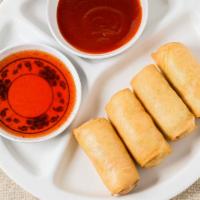 Veggie Thai Egg Rolls · Four deep fried egg rolls stuffed with carrot, cabbage and silver noodles, served with sweet...