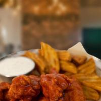 Original Wings · Classic bone-in chicken wings tossed in your favorite flavor. Served with bleu cheese or ran...