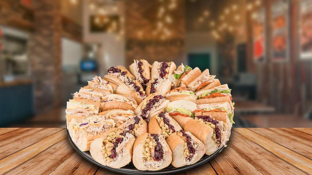 The Turkey Lover™ - Party Tray · Assortment of our delicious oven-roasted turkey subs:. The Bobbie®, Cole Turkey® and the Homemade Turkey sub. (Served with a side of mayo, mustard, pickles and peppers.)