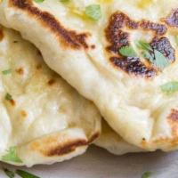 Paneer Kulcha · Housemade naan filled with Indian fresh cheese.