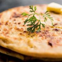 Aloo Paratha · Whole wheat bread stuffed with mashed potatoes and green peas.